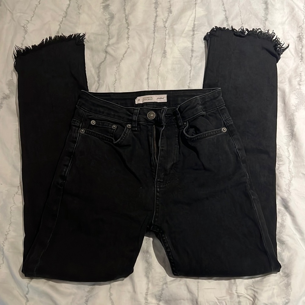 Black skinny jeans from Subdued. Not distressed. Cigarette flare at the bottom.